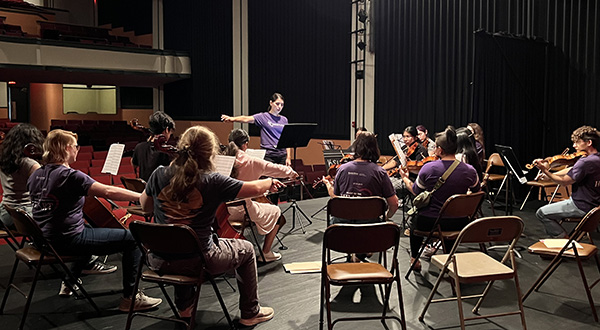 K-State student conducts youth orchestra